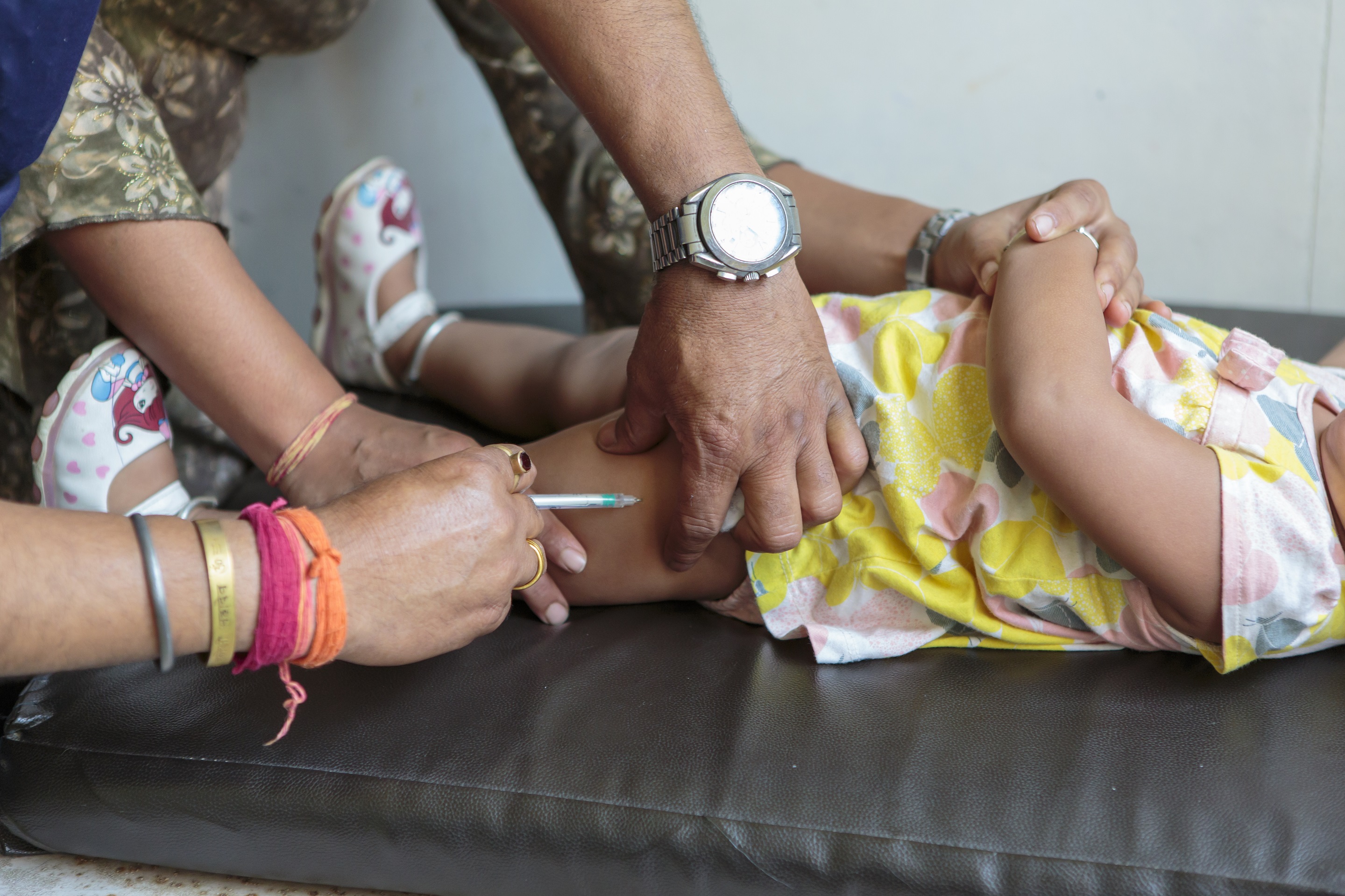 A 15-month girl receives measles-rubella vaccine at Patan Hospital, Lalitpur, Nepal