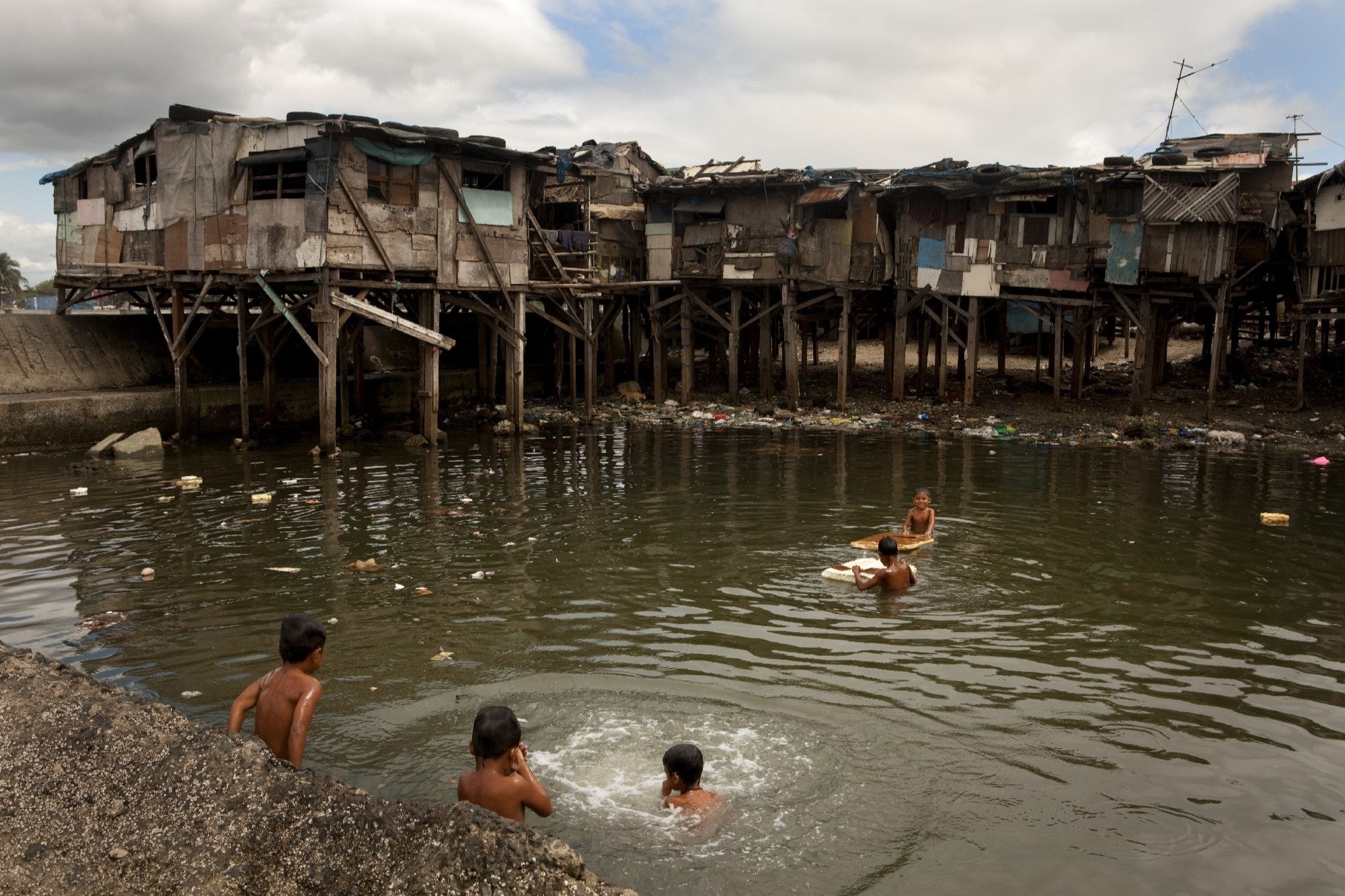 Children swimming in Manila, Philippines